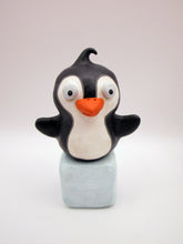 Christmas folk art penguin on block of "ice"