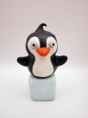 Christmas folk art penguin on block of 