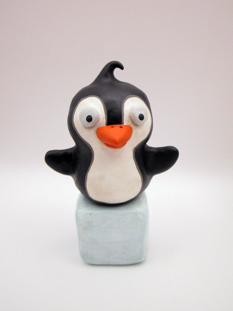 Christmas folk art penguin on block of 