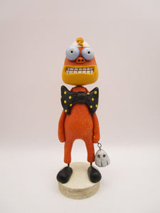 Halloween folk art candy corn man with spooky ghost charm
