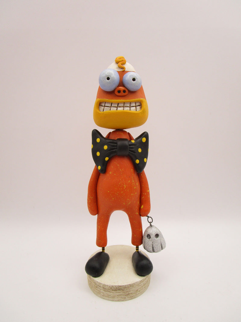 Halloween folk art candy corn man with spooky ghost charm