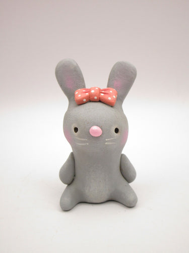 Spring folk art or Valentine folk art sitting grey bunny with bow