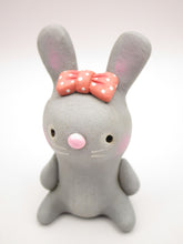 Spring folk art or Valentine folk art sitting grey bunny with bow