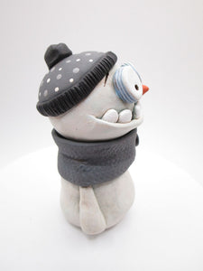 Christmas cute and creepy snowman wearing beanie and scarf