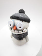 Christmas cute and creepy snowman wearing beanie and scarf