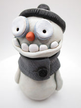 Christmas cute and creepy snowman wearing beanie and scarf