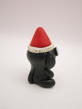 Christmas little black dog with Santa hat