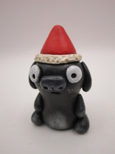Christmas little black dog with Santa hat