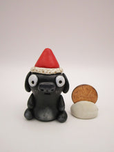 Christmas little black dog with Santa hat