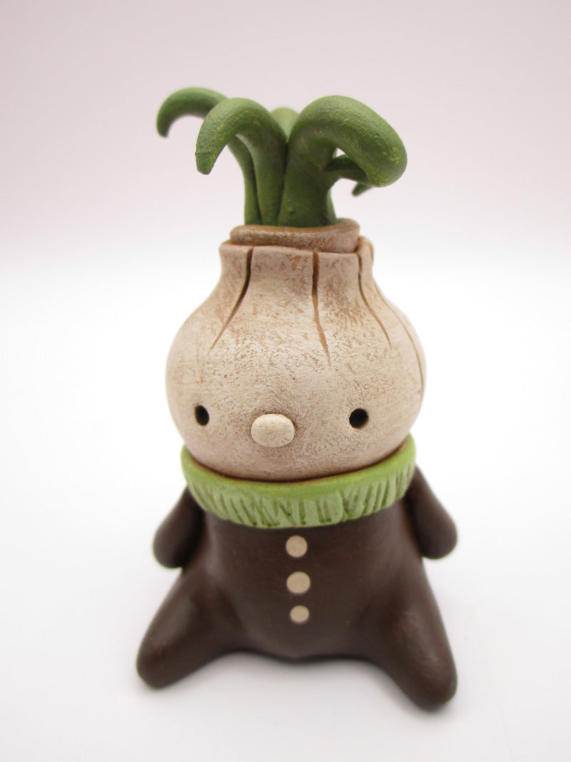 Wacky character spring folk art little sitting onion man with curly top