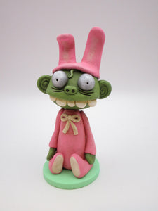 Easter ZOMBIE dressed in bunny suit sitting