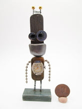 Wacky character small robot with antique clock face