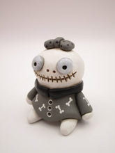 Halloween small cute skeleton girl in bone dress and bow