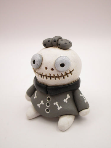 Halloween small cute skeleton girl in bone dress and bow