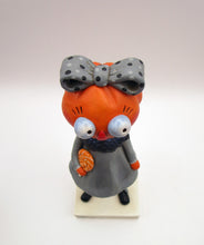 Halloween folk art pumpkin girl holding Halloween lollipop