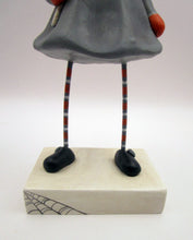 Halloween folk art pumpkin girl holding Halloween lollipop