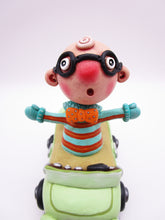 Wacky character man with glasses in car