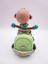 Wacky character man with glasses in car