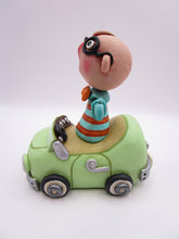 Wacky character man with glasses in car