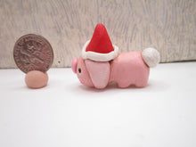 Mini pink bunny with Santa hat full body just over one inch tall