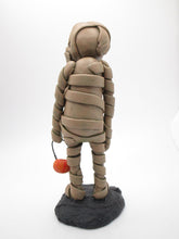 Halloween MUMMY character with little pumpkin bucket