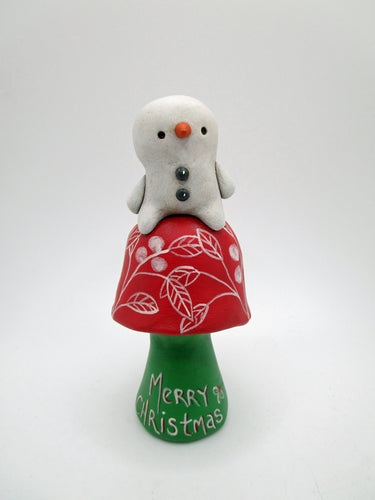 Christmas folk art SNOWMAN sitting on a red and green mushroom