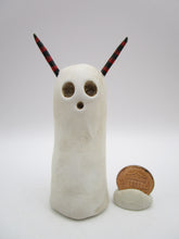 Halloween folk art spooky ghost with red and black horns