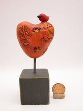 Valentine heart with bird on wood block with orange tones