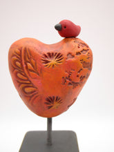 Valentine heart with bird on wood block with orange tones