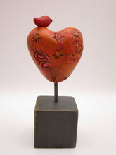 Valentine heart with bird on wood block with orange tones