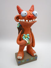 Spring folk art large monster with sack of flowers on his back