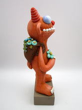 Spring folk art large monster with sack of flowers on his back