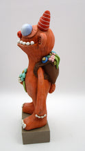 Spring folk art large monster with sack of flowers on his back