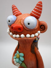 Spring folk art large monster with sack of flowers on his back