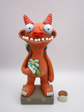 Spring folk art large monster with sack of flowers on his back