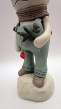 Christmas folk art snowman in muted teal overalls with heart stick