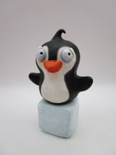 Christmas folk art penguin on block of "ice"