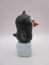 Christmas folk art penguin on block of "ice"