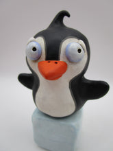 Christmas folk art penguin on block of "ice"