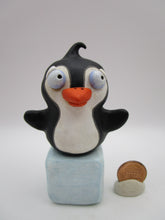 Christmas folk art penguin on block of "ice"