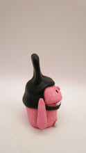 Easter folk art pink MONSTER wearing a black bunny hat