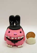 Easter folk art pink MONSTER wearing a black bunny hat