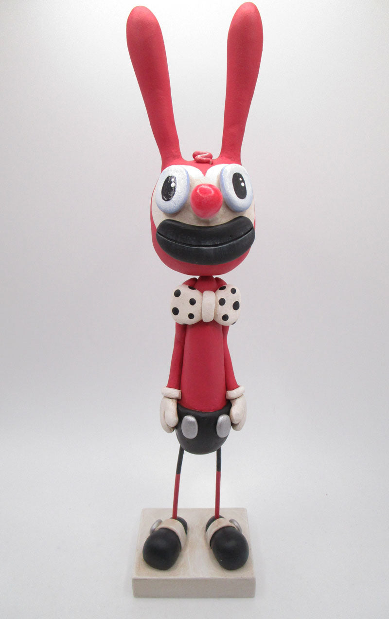 Pink rabbit cartoon style with tall ears and mickey style pants