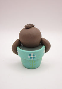 Spring folk art cute small sloth in a pot