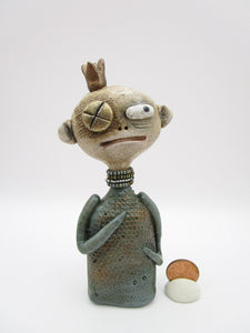 Primitive man with crown and lots of fine crackle and texture misc