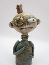Primitive man with crown and lots of fine crackle and texture misc