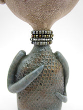 Primitive man with crown and lots of fine crackle and texture misc