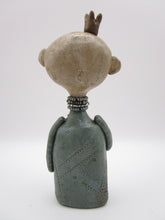Primitive man with crown and lots of fine crackle and texture misc