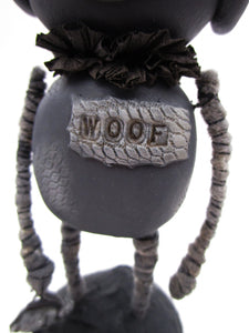 Wacky character primitive style DOG with antique cracker jack charm