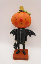 Halloween folk art pumpkin man dressed as a bat